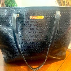 Michael Kors Black patent leather signature tote.